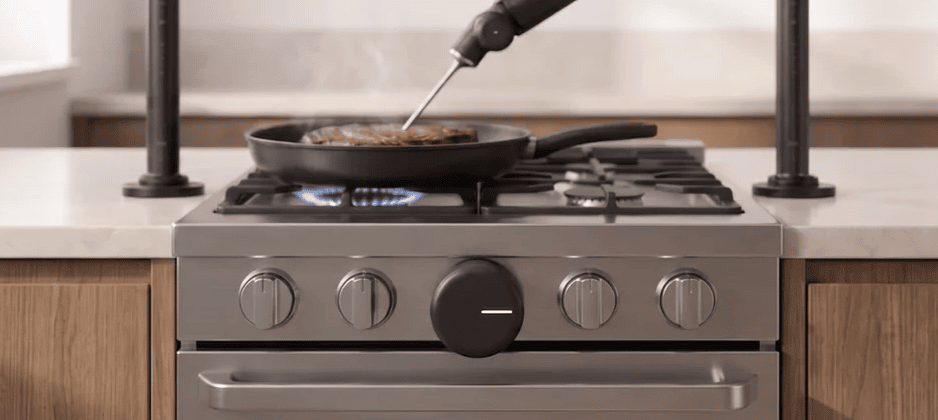 Cheffy temperature probe in a steak on a lit gas burner with smart stove controls